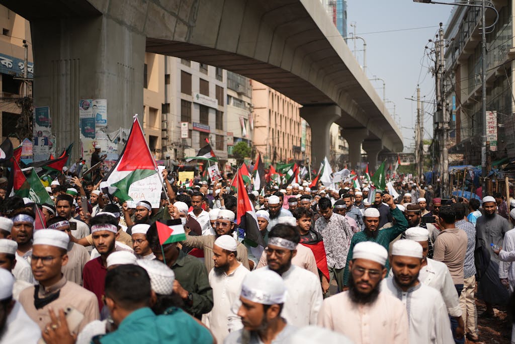 Iran vs Israel War A large Pro-Palestinian protest with flag waving and banners, demonstrating solidarity in Dhaka, Bangladesh.