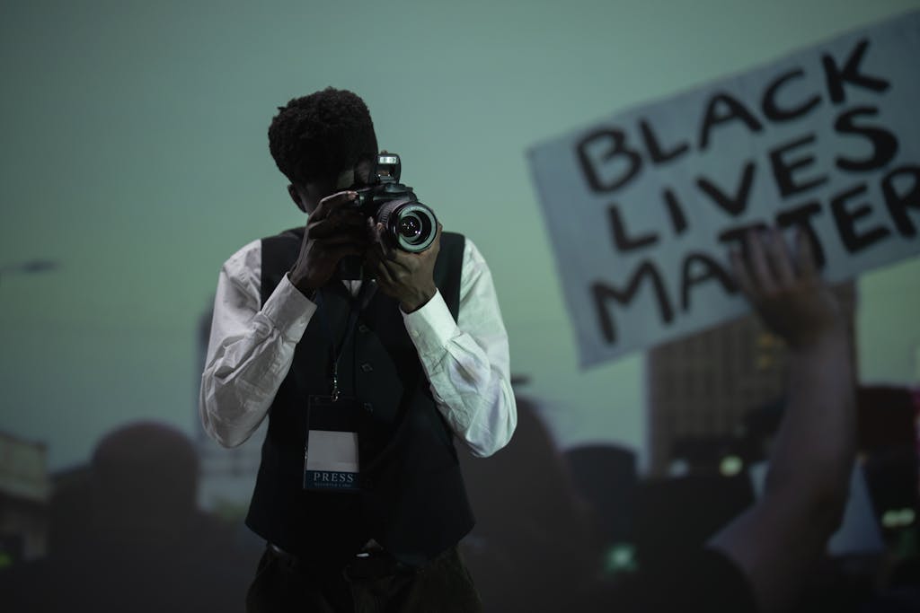 United Kingdom Press Release: A Complete Guide to Writing, Distribution, and Media Impact 2026 A photojournalist capturing a pivotal moment at a Black Lives Matter protest.