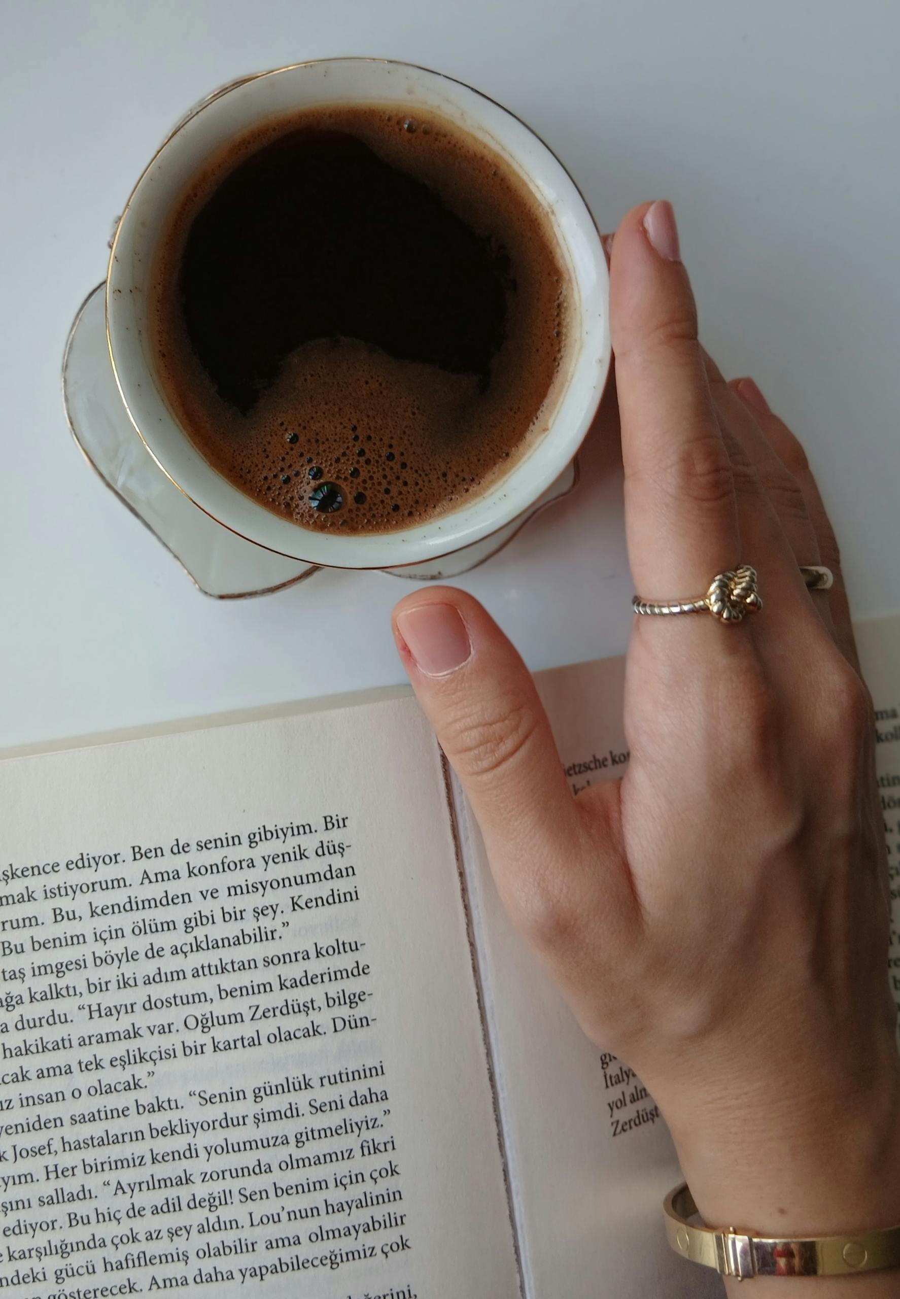 A serene moment featuring a coffee cup and an open book, perfect for relaxation Story Protocol Roadmap