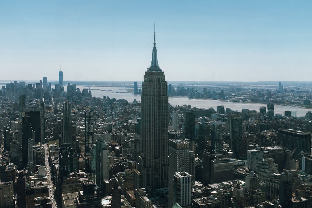 Tri Town News Sidney NY Obituaries Empire State Building dominating the New York City skyline during the day.