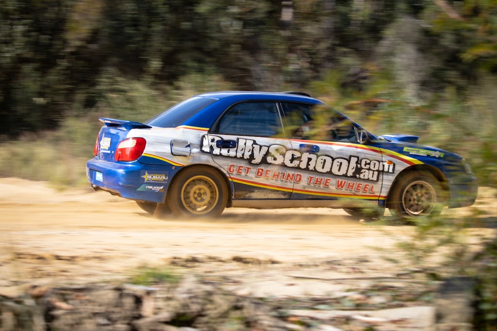 Get Fast Release News on IPS Action-packed rally car speeding on a dirt track at Colo Heights, Australia. Experience the thrill of motorsport.