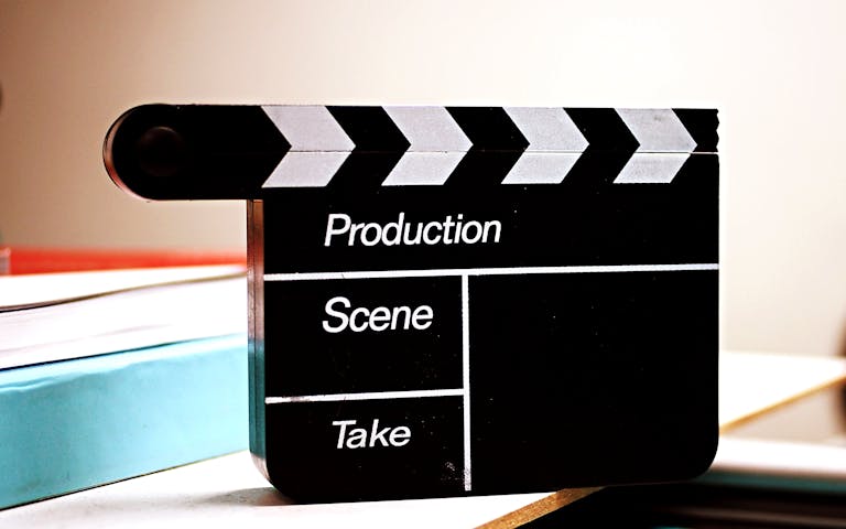 Studio News Set clapperboard on a desk, ideal for media and production themes.