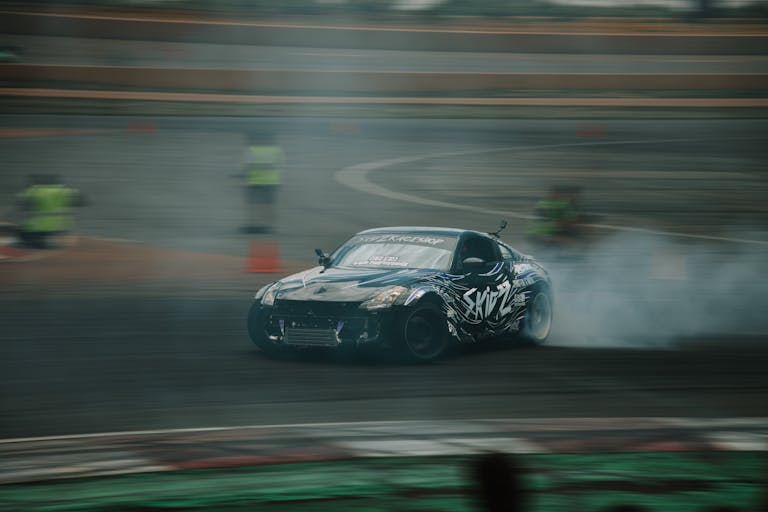 2004 Nissan 350Z Coilovers drift racing action captured with a Nissan car at a race track in Colorado, USA.