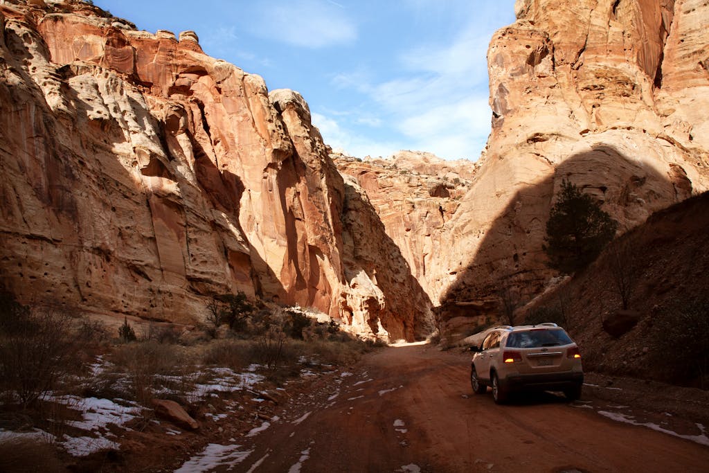 Wheon Grand Theft Auto: A Complete Deep Dive into the Iconic Open-World Phenomenon SUV travels through a stunning, rugged canyon under a blue sky, showcasing adventure and nature's beauty.