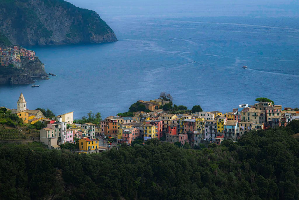 Robert Golob A breathtaking aerial view of Cinque Terre with vibrant houses by the sea in Italy.