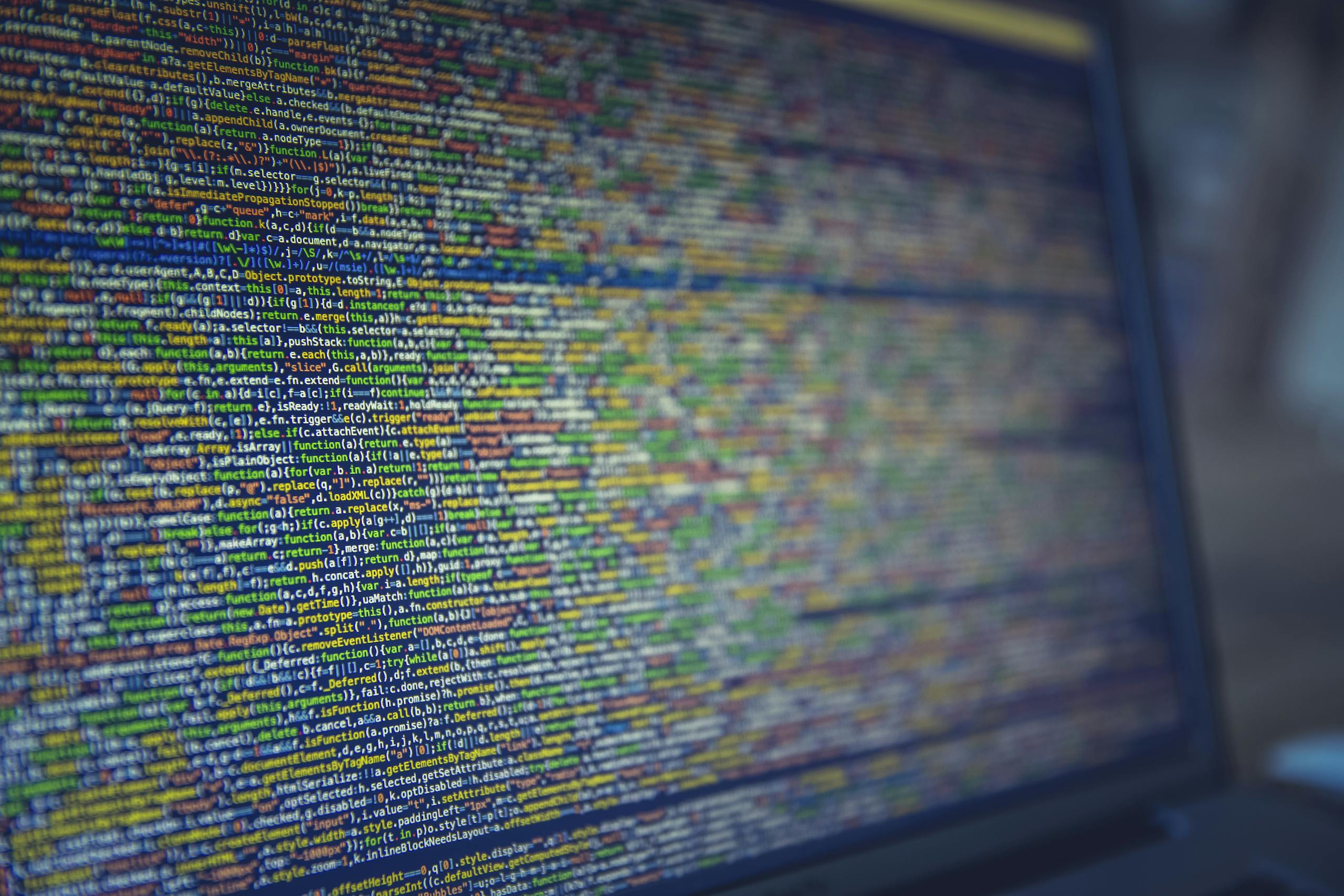 HR Software A detailed view of colorful source code displayed on a computer screen, representing modern programming and technology.