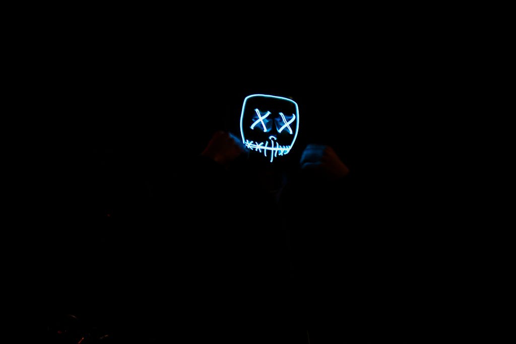 Florncelol A glowing LED mask in a dark environment creates a mysterious and eerie atmosphere.