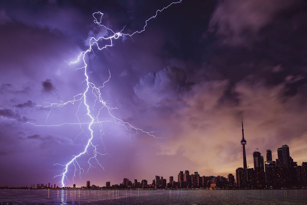 Epcylon A striking lightning bolt illuminates the Toronto skyline against a dramatic stormy sky.
