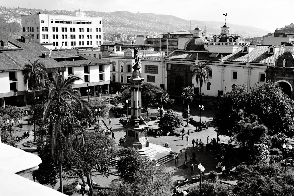 Impupdates.comwow Independence Black and white aerial view of Plaza Grande in Quito, showcasing colonial architecture and the bustling city atmosphere.