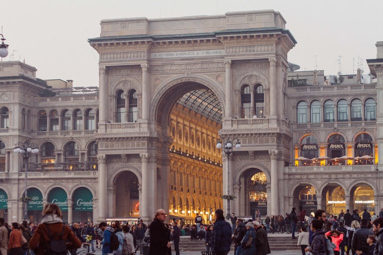 AC Milan vs SSC Bari Timeline Crowds gather at the iconic Galleria Vittorio Emanuele II, a landmark shopping arcade in Milan, Italy.