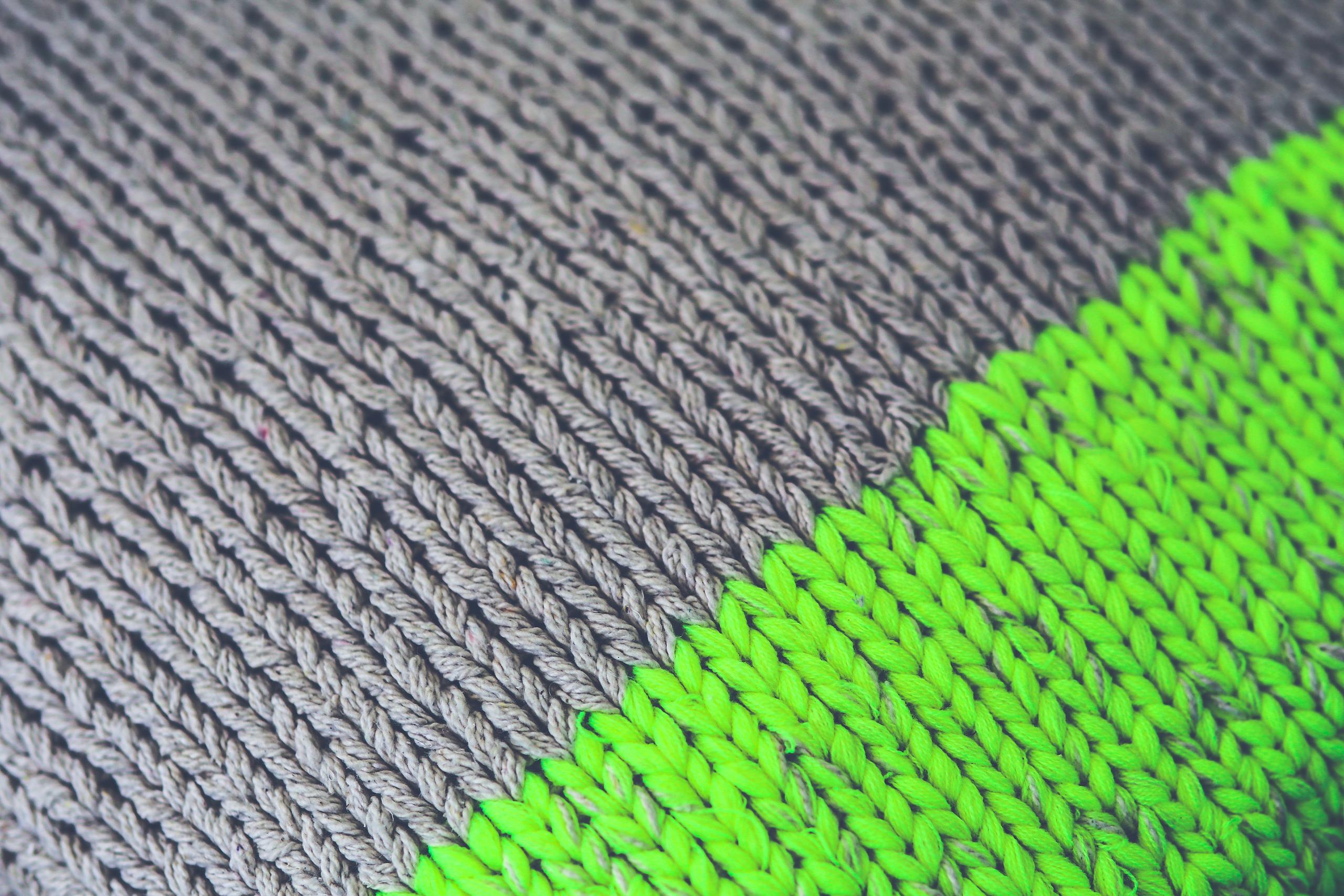 Binuscx Detailed view of beige and lime woolen knit fabric showcasing texture and pattern.