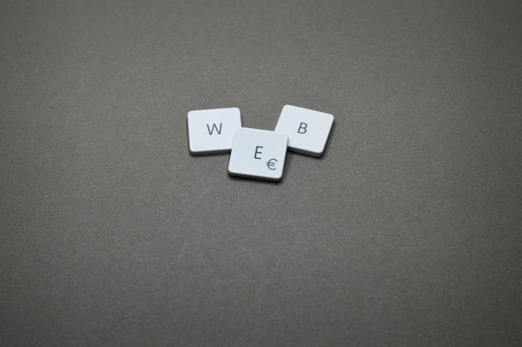 Gonzay Minimalist image of keyboard keys spelling 'WEB' on a plain background.