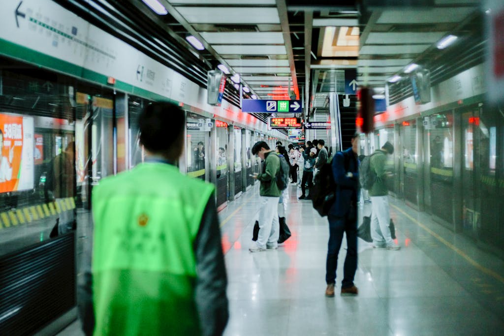 Chinese Train Breaks World Record, Hits 700 km/h in Just 2 Seconds People waiting at a subway platform in Nanjing, China, showcasing urban commute.