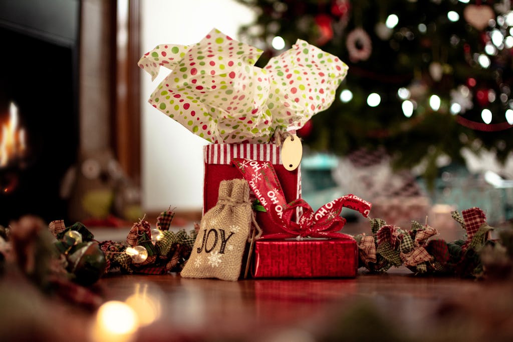VirtusPlays Warm holiday scene with decorated gifts under a Christmas tree.