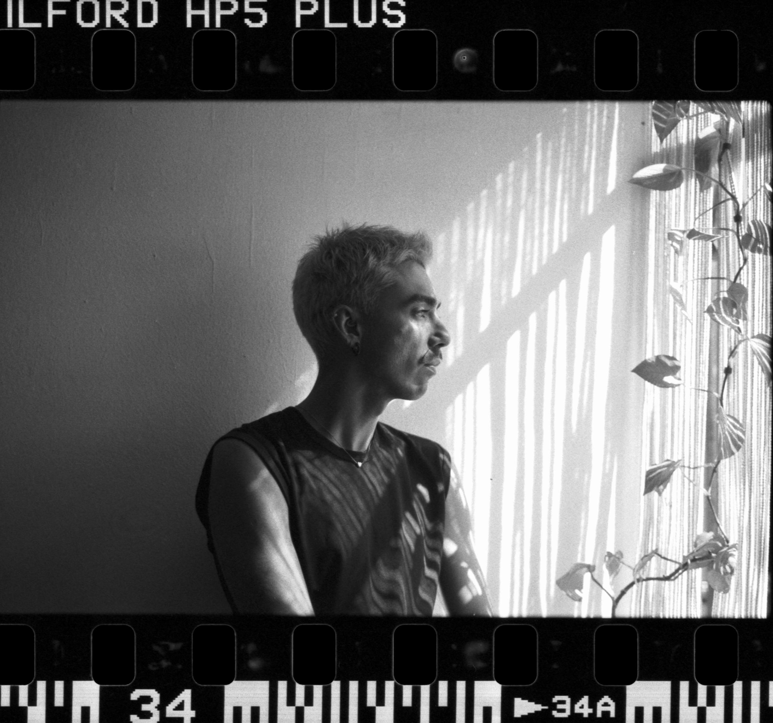 WiteloversWitelovers Artistic film portrait of a man by a window in León, Mexico.