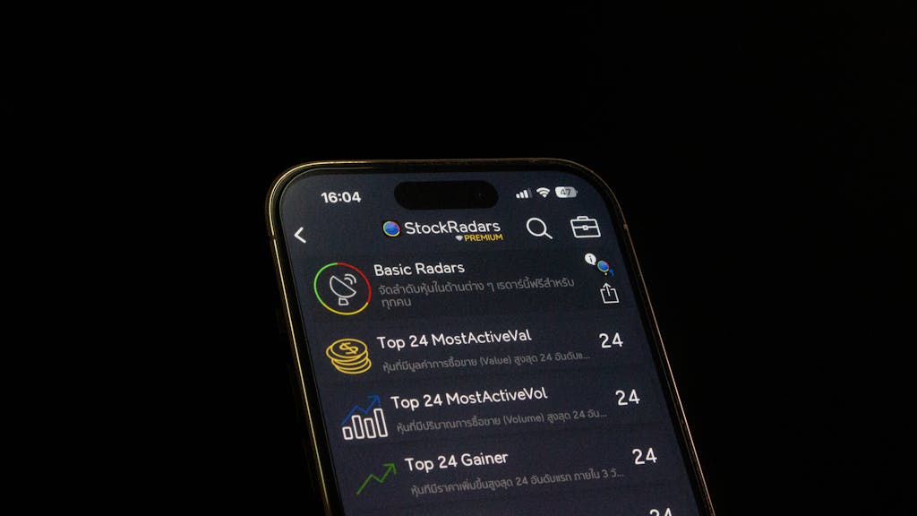 Kongotech Org Close-up of a smartphone displaying a stock trading app interface, emphasizing financial analysis and investment insights.
