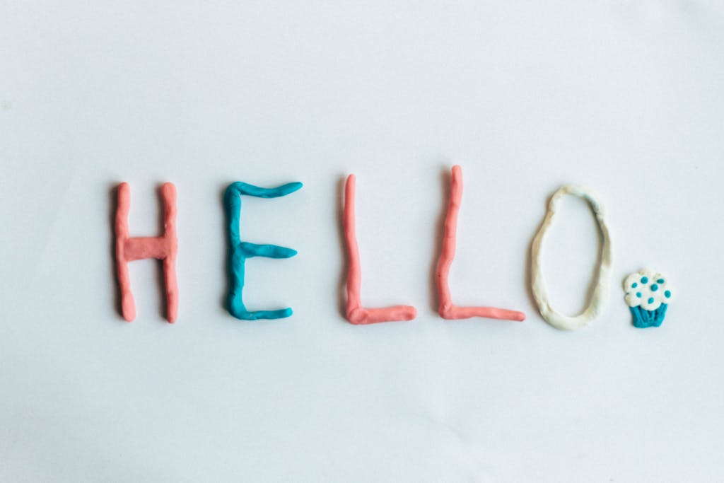 Cray0lav0mit  Creative hello greeting spelled out with colorful clay on a white background.