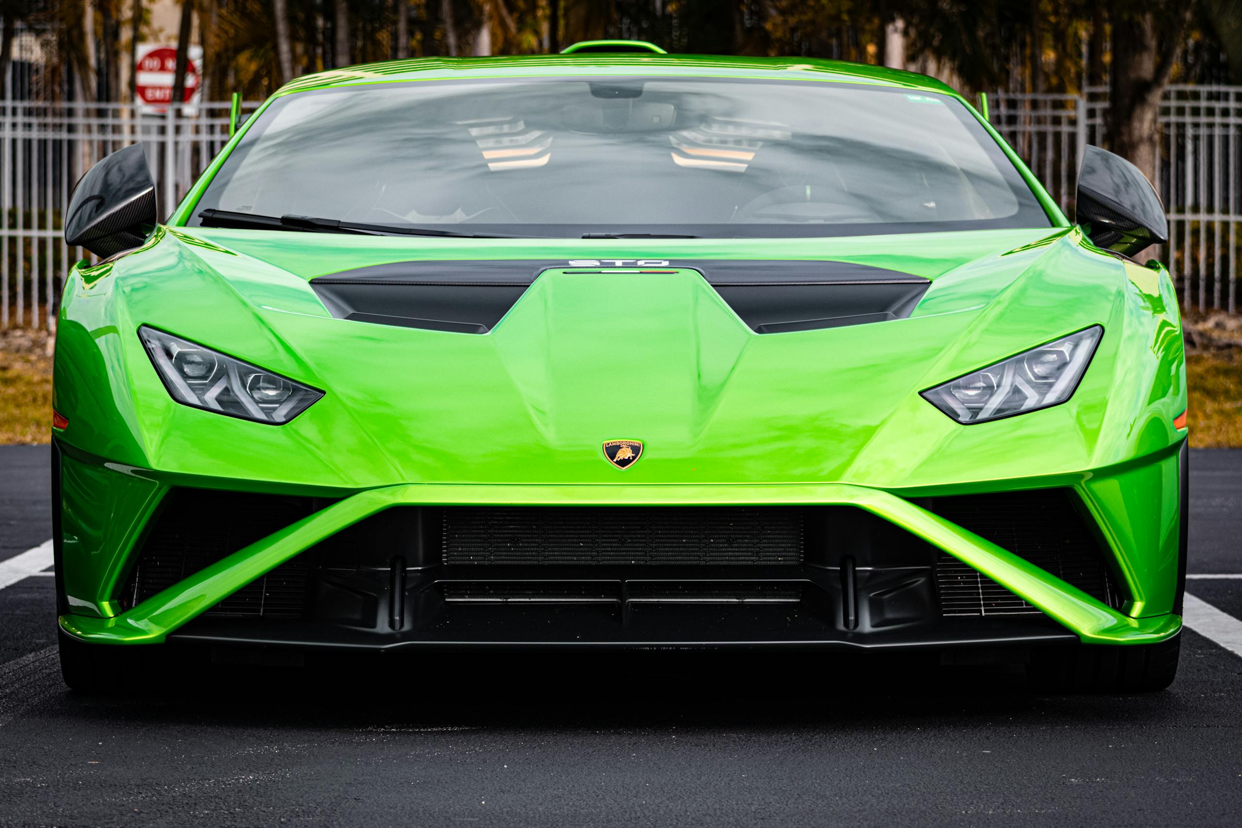 Inter Miami vs Tigres UANL Timeline Striking green sports car parked on Miami street, showcasing sleek design and luxury.