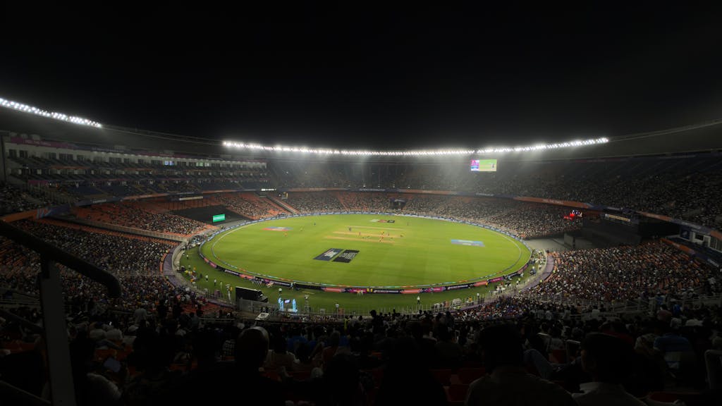 IPL League 2026  A captivating night cricket match with a large crowd at Narendra Modi Stadium in Ahmedabad, India.