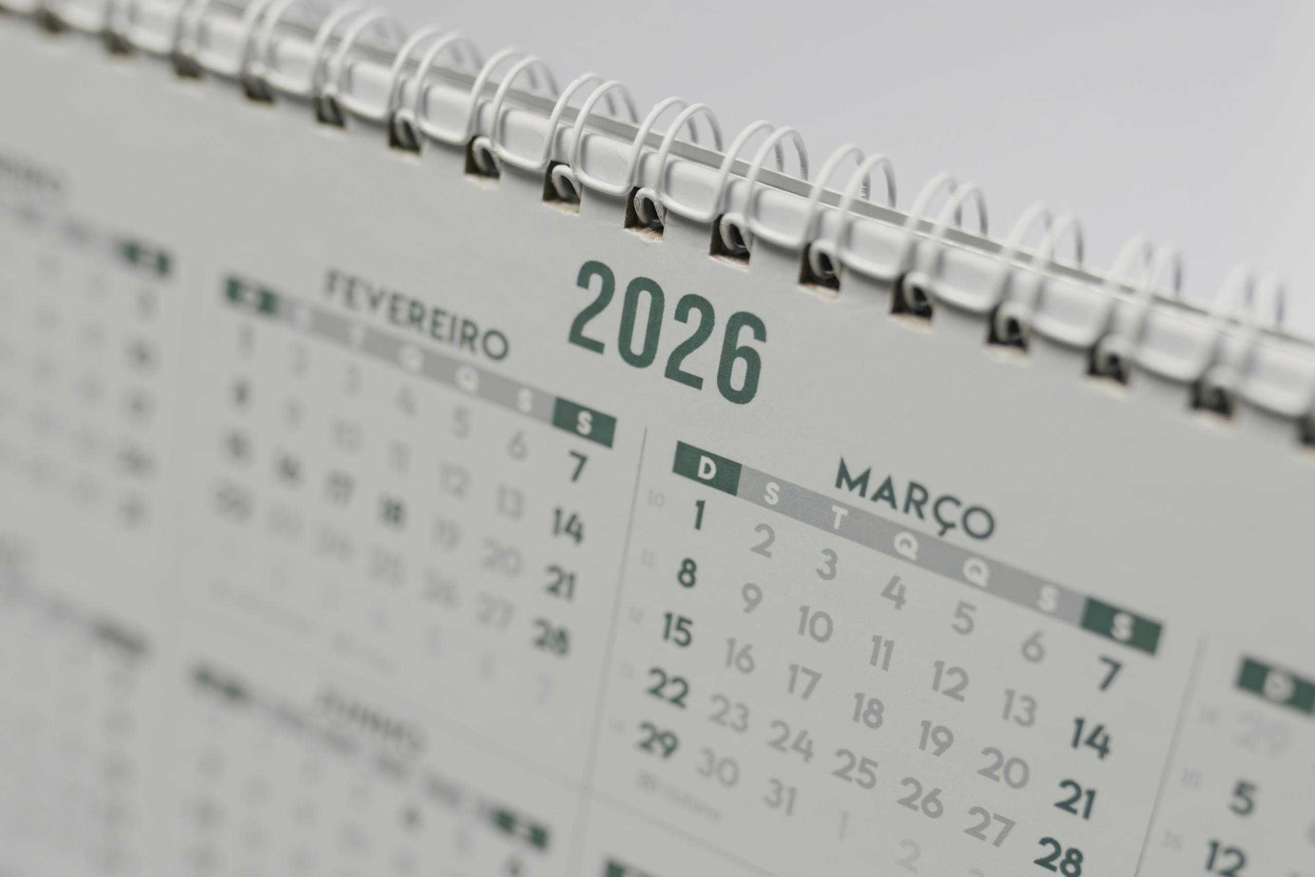 IPL League 2026 Close-up view of a 2026 spiral-bound desk calendar showing February and March.